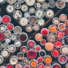 A collection of red buttons that can be used for clothing.